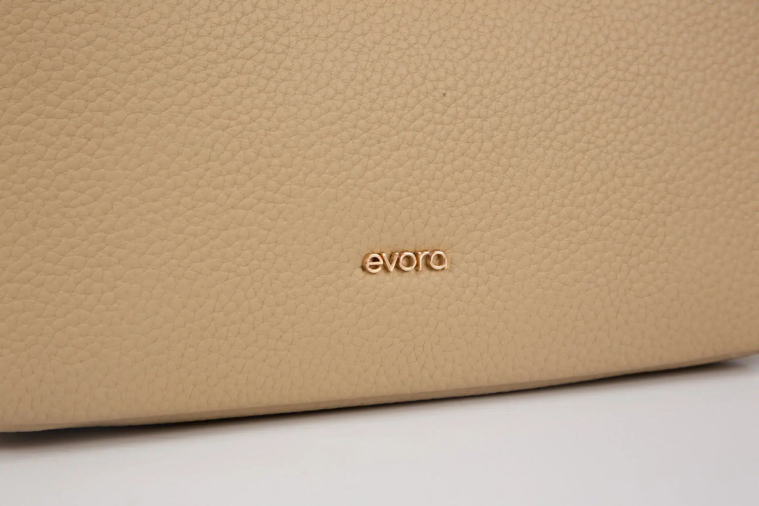 A petite women's handbag with an elegant design - beige